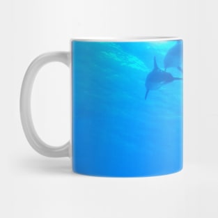 Dolphins swimming underwater Mug